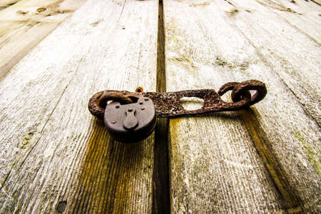 Rusty Old Padlock on Doorの写真素材