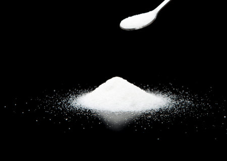 Pile of Sugar with table Spoonの写真素材