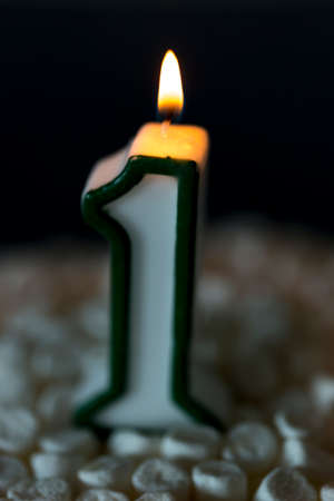 First Birthday Candle Burning. The number one.の写真素材