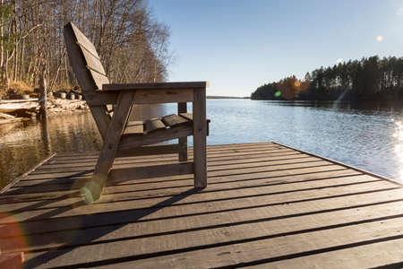 Chair on Pier in the Umea River in Swedenの写真素材