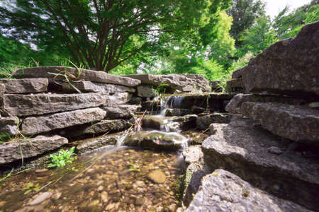 Water Streaming in Creekの写真素材