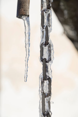 Chain Covered in Ice with an Icicle