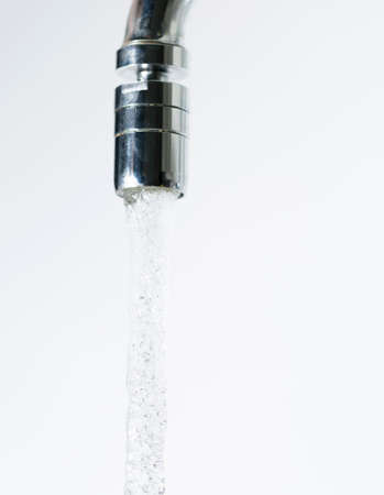 Water Pouring from Water Faucetの写真素材