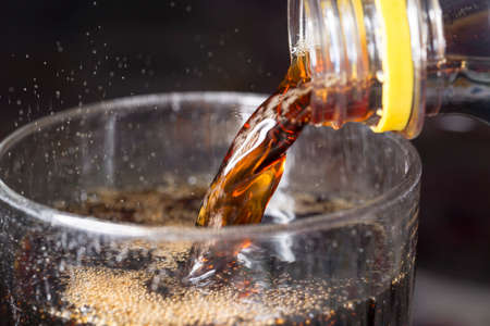 Soda Pouring into Glass Close upの写真素材