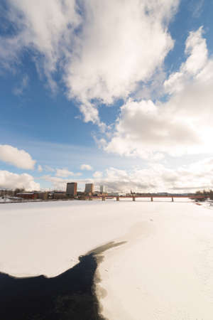 Downtown Umea, Sweden and its river in winterの写真素材