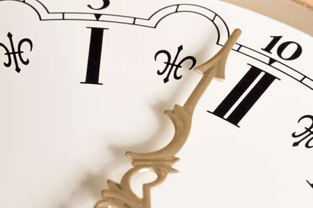 Clock Hand Close Up with Roman Numeralsの写真素材
