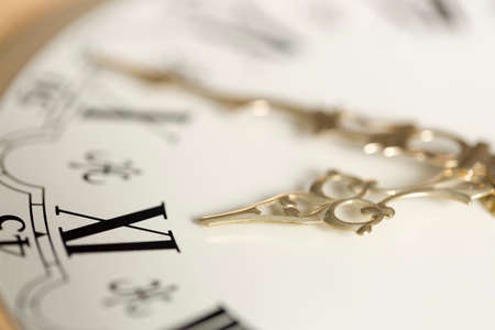 Clock Close Up with Golden Coloured Handsの写真素材