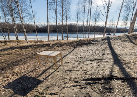 Table by Icy River in Spring
