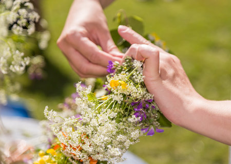Woman Making a Swedish Midsummer Head Creation.の写真素材