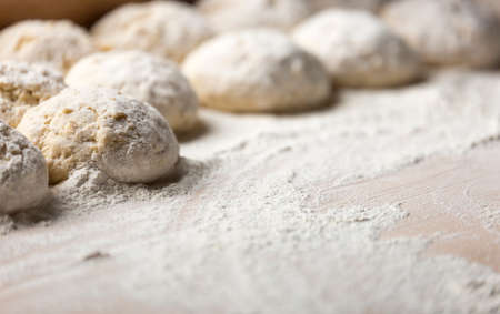 Buns of Dough Covered in Flour close up.の写真素材