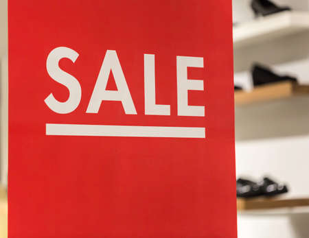 Sale Sign with Shoes in the Background.の写真素材