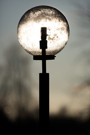 Sun Light Shining through Street Light.