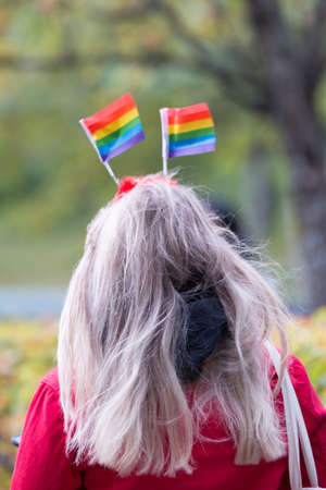 Female with Rainbow Pride Flags in her Hair.の写真素材