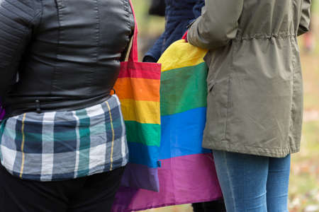 Girls with Rainbow Flag and Bag.の写真素材