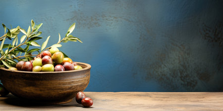 Wooden plate with olives on a plain background, space for text or advertising.の素材