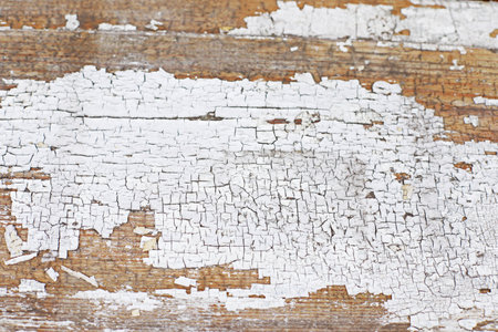 Old wooden background with white dry paint, space for textの写真素材