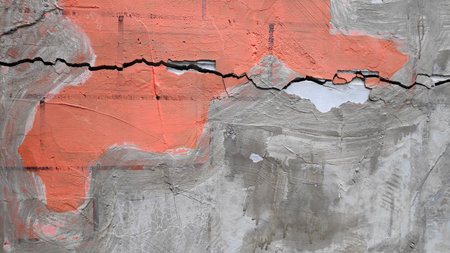 Gray cement concrete wall pattern with cracks on the surface as backgroundの写真素材