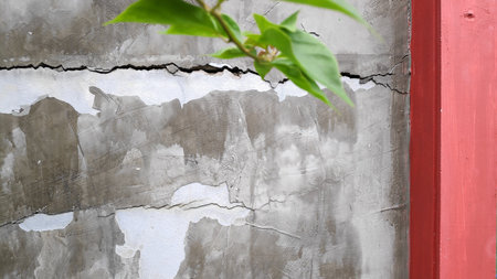Gray cement concrete wall pattern with cracks on the surface as background