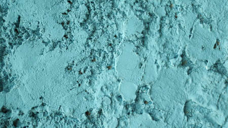 The pattern of blue plaster is rough on the wall of the fence.の写真素材