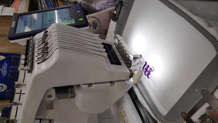 Computerized embroidery machine Sewing machine while operating textile.の写真素材