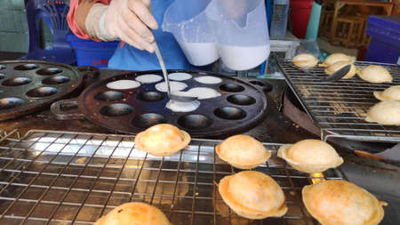 Thai Coconut Pancakes (Khanom Kok) is a traditional Thai dessert.の写真素材
