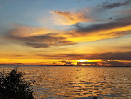The sunset over the sea in spring makes the sky look beautiful. Chon Buri, Thailand.の写真素材