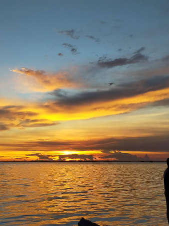 The sunset over the sea in spring makes the sky look beautiful. Chon Buri, Thailand.の写真素材
