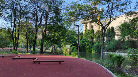 Red jogging track in Bangkok, Thailand public park.