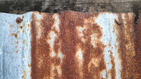 The old and dirty rusty galvanized sheet is used as a background.の写真素材