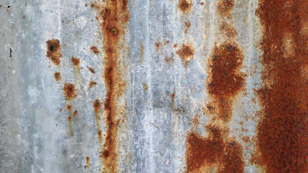 The old and dirty rusty galvanized sheet is used as a background.の写真素材