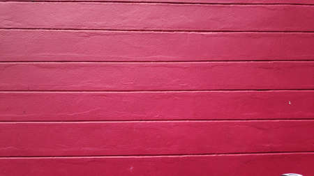 Stock Photo - Old building with red and pink background on cement wall surface.の写真素材