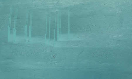 Stock Photo - Textured cement plaster or turquoise concrete wall is used as a background.の写真素材