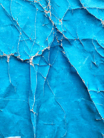 The old canvas is torn and damaged.の写真素材
