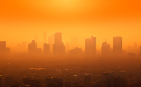 Aerial view of smog and fine dust of pm2.5 covered city. Dust fog pollution,air pollution,PM 2.5 pollution concept.の素材