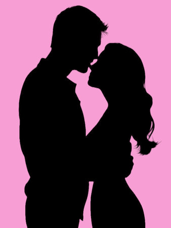 Silhouette of a loving couple, isolated on a pink background.Wedding concept.の素材