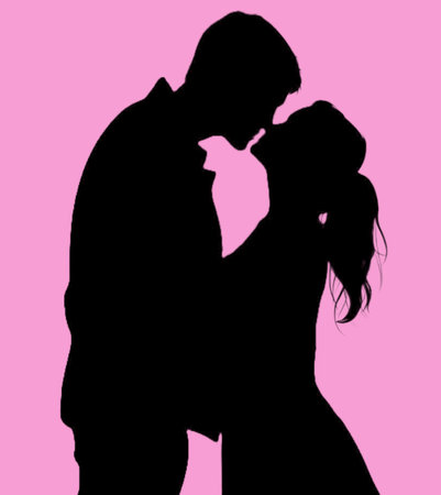 Silhouette of a man and woman kissing on a pink background.Valentines day concept.の素材