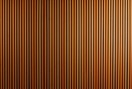 Vertical striped wooden panel texture design corrugated lines on a textured surface.Wooden Slat Wall Panels.の素材