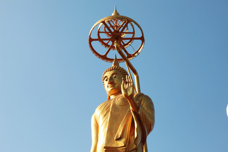 big stand gold buddha in Thailandの写真素材