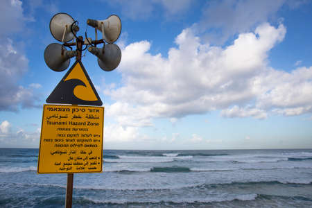 A tsunami warning sign posted at the beach in Tel Avivの写真素材