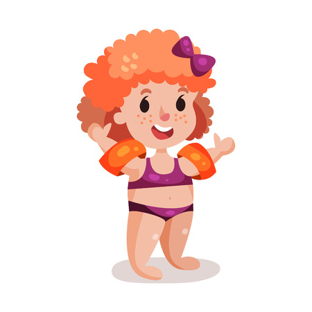 Cute happy redhead girl in purple swimsuit with inflatable armbands.のイラスト素材