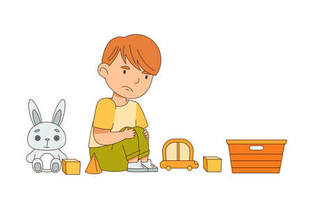 Grumpy Boy Sitting on the Floor with Toys and Grizzlingのイラスト素材