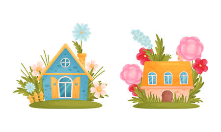 Cute small houses among summer flowers cartoon vector illustration on white backgroundのイラスト素材