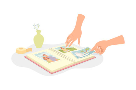 Human Hands Sticking Photo Card in Album at Table Vector Illustrationのイラスト素材