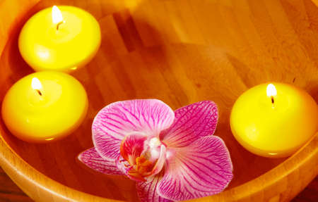 Floating candles and orchide flowerの写真素材