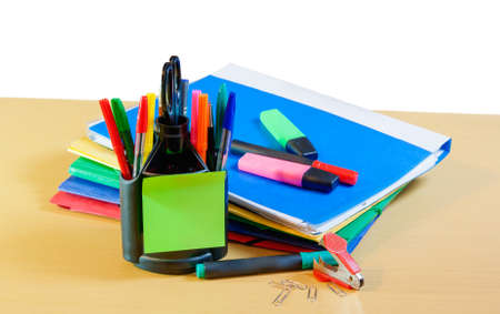 Group of multicolored office folders, glasses and office supplies on tableの写真素材