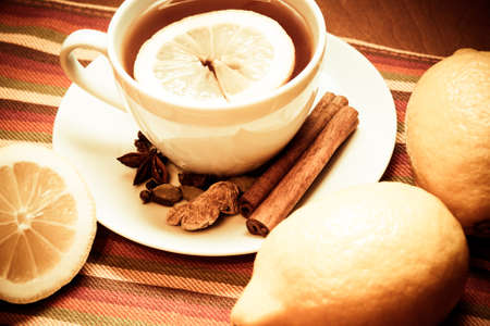 Black tea with lemon and spices. Vintage styleの写真素材
