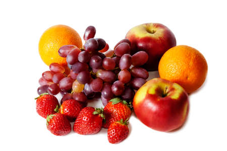 Fresh fruits and berries isolated on whiteの写真素材