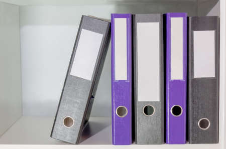 Folders for documents on a book shelfの写真素材