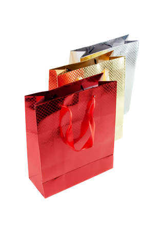 Bunch colorful paper bags for gifts isolated on whiteの写真素材
