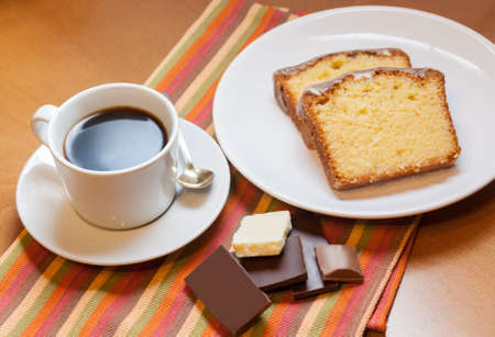 Two pieces of cake, chocolate  and cup of coffeeの写真素材